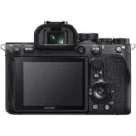 Back view of a Sony mirrorless camera with LCD screen and controls.