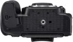 Bottom view of a DSLR camera body with tripod mount.