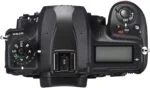 Top view of a DSLR camera body with control dials and LCD screen.