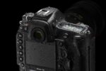 Nikon D6 DSLR camera body with lens, showcasing professional photography equipment.