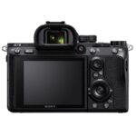 Back view of Sony Alpha 7 III camera with 28-70mm lens, featuring controls and LCD screen.