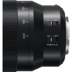 Close-up of a camera lens with focus and stabilization controls, available at Camix UK.