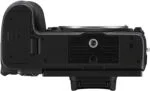 Bottom view of a camera body showing tripod mount and battery compartment.