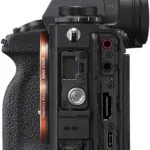 Side view of Sony Alpha 1 camera body showing ports and controls.