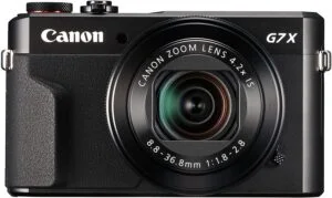 Canon PowerShot G7 X Mark II digital camera with zoom lens.