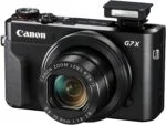 Canon PowerShot G7 X Mark II digital camera with zoom lens and flash.