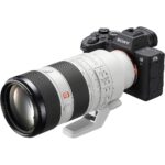 Sony mirrorless camera with telephoto lens, ideal for professional photography.