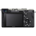 Back view of Sony A7C camera with 28-60mm lens, featuring controls and LCD screen.