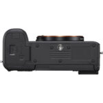 Bottom view of Sony A7C camera body with 28-60mm lens, silver finish.