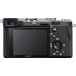 Back view of Sony A7C mirrorless camera in silver, showcasing controls and LCD screen.