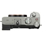 Top view of a silver Sony A7C mirrorless camera body with control dials.