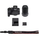 Canon EOS R10 mirrorless camera with 18-150mm lens, battery, charger, and strap.