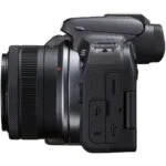Canon EOS R10 mirrorless camera with 18-45mm lens, side view.
