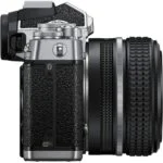 Nikon Z fc mirrorless camera with 28mm lens, side view, available at Camix UK.