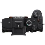 Top view of Sony A7R V camera body with control dials and buttons.