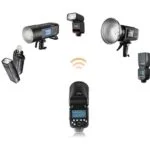 Various camera flashguns and lighting equipment for photography.