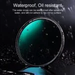 Waterproof, oil-resistant camera lens filter with water droplets.