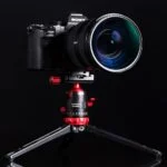 Sony mirrorless camera with lens on tripod, ideal for photography enthusiasts in the UK.