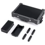 Professional camera monitor with battery and accessories, ideal for video cameras and photography gear.