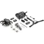 DJI drone kit with controller, goggles, battery, and accessories on display.