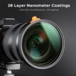 Close-up of a camera lens with 28 layer nanometer coatings on a tripod.