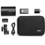 Godox AD100Pro flash kit with battery, charger, and case, ideal for photography lighting.