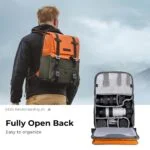 Man with camera backpack and open view showing organized photography gear.