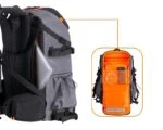 Gray and orange camera backpack with compartments for photography gear.