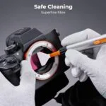 Camera sensor cleaning with K&F Concept tool, safe for mirrorless and DSLR cameras.