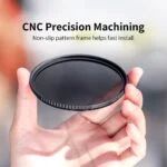 Hand holding a camera lens filter with CNC precision machining.