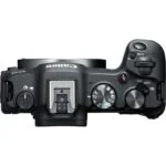 Top view of a Canon mirrorless camera body with control dials and hot shoe.