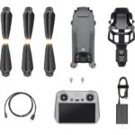 DJI drone with controller, propellers, and accessories from Camix camera shop UK.