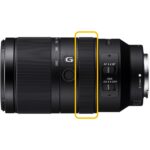 Sony E mount telephoto zoom lens with focus and stabilization controls.
