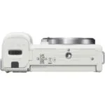 Bottom view of a white mirrorless camera body with lens mount, suitable for photography enthusiasts.