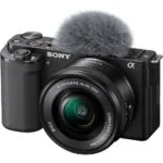 Sony mirrorless camera with lens and microphone, ideal for video and photography.