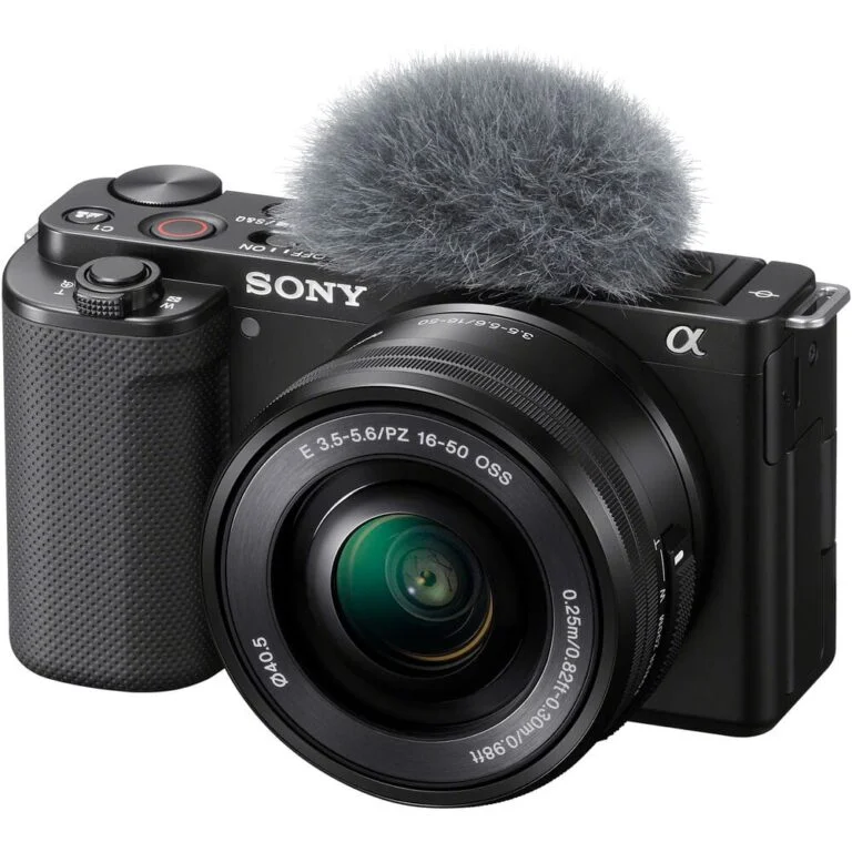 Sony mirrorless camera with lens and microphone, ideal for video and photography.