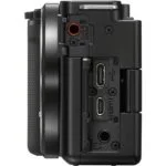 Side view of a digital camera body showing ports and controls.