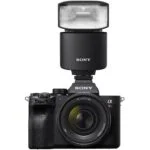 Sony mirrorless camera with lens and flash, available at Camix UK.