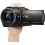 Sony 4K Handycam camcorder held in hand, available at Camix camera shop UK.