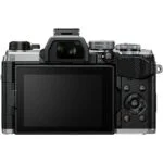 Back view of a digital mirrorless camera with LCD screen and control buttons.