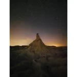 Starry night sky over a rocky landscape, ideal for testing digital cameras and lenses.