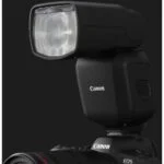 Canon camera with flashgun, ideal for professional photography.