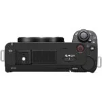 Top view of a mirrorless camera body with control dials and buttons.