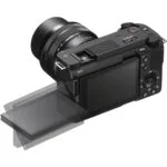 Mirrorless camera with tilting screen and lens, available at Camix UK.