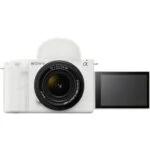 Sony mirrorless camera with lens and flip-out screen, ideal for photography and video.