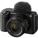 Sony mirrorless camera with lens and microphone, ideal for vlogging and photography.
