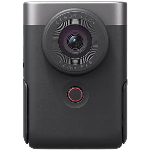 Compact Canon camera with lens, ideal for vlogging and travel photography.
