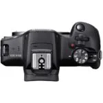 Top view of Canon EOS R100 camera body with control dials, ideal for photography enthusiasts.