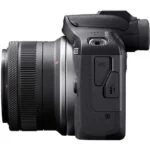 Side view of a Canon mirrorless camera body with lens attached, available at a UK camera shop.