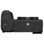 Bottom view of a camera body showcasing mount and battery compartment.